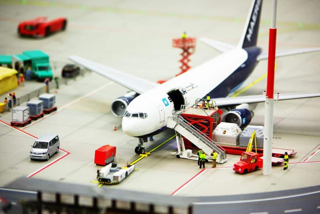 A plane being loaded up with cargo for take-.off