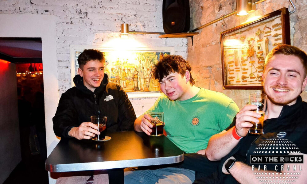 The author and two friends having a drink in Barcelona.