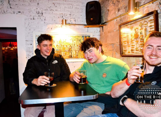 The author and two friends having a drink in Barcelona.