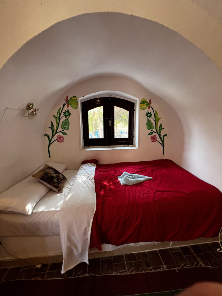 The bed inside one of the Al Booarait Hotel's rooms