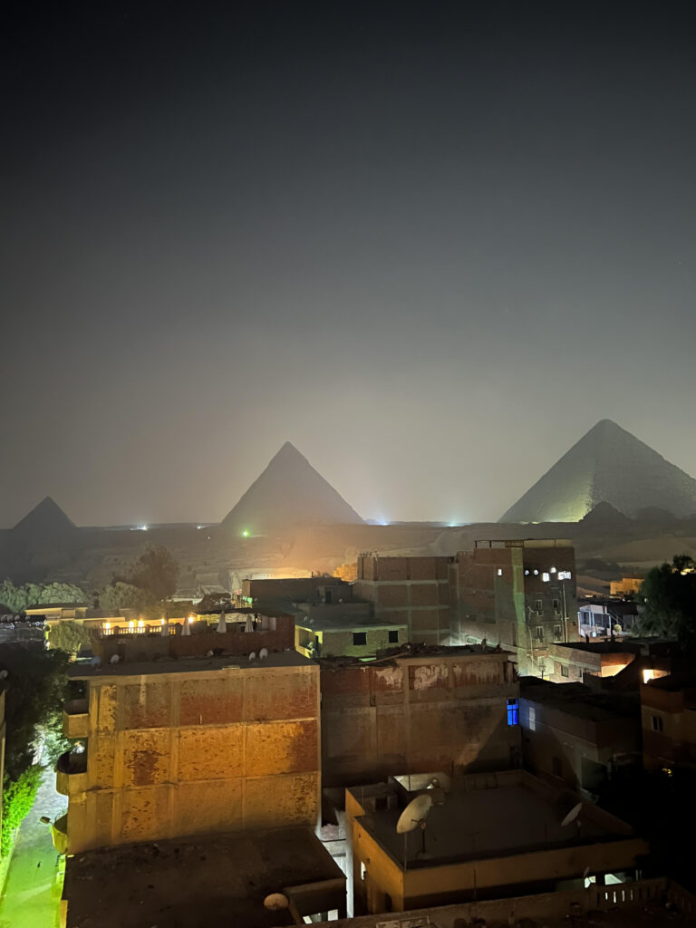 The Pyramid of Menkaure, the Pyramid of Khafre and the Great Pyramid of Giza at night time.