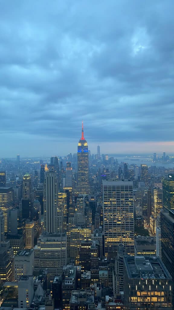 A view of many skyscrapers in New York with the Empire State Building at the centre.