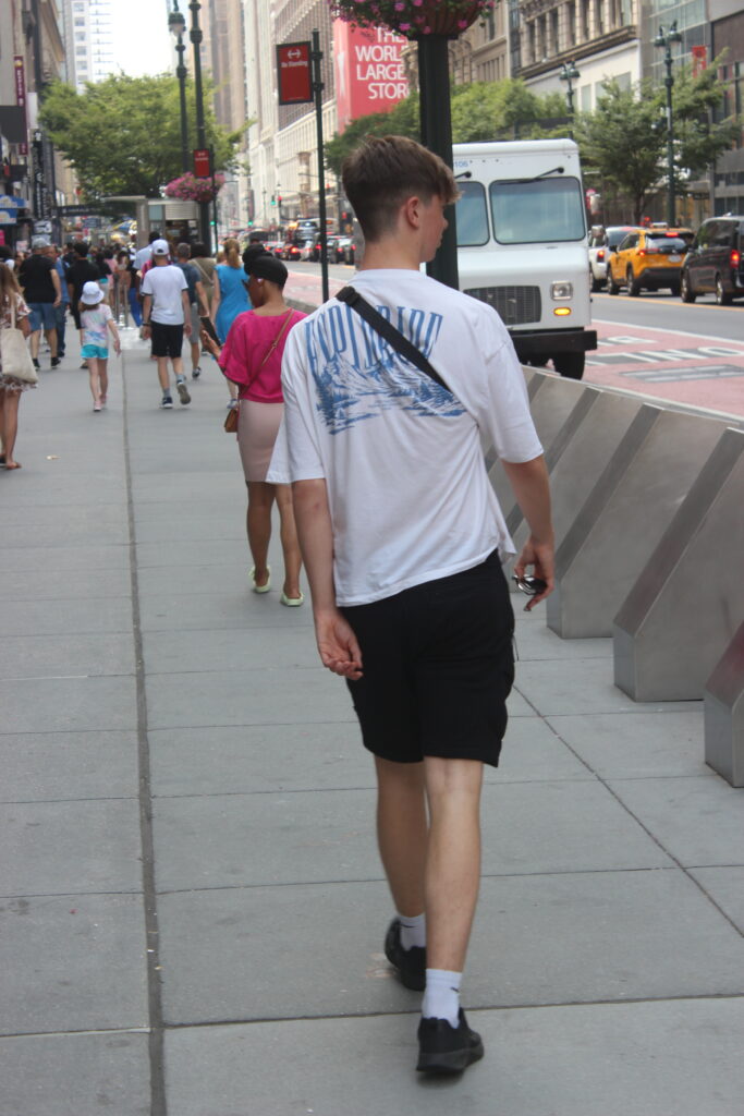 The Author's brother walking down a street in New York.