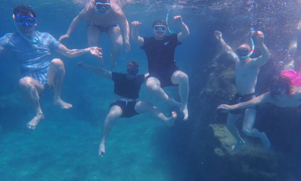 The author and his friends get a photo taken under the water.