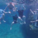 The author and his friends get a photo taken under the water.