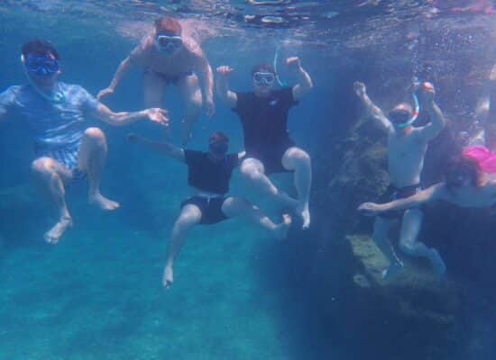 The author and his friends get a photo taken under the water.