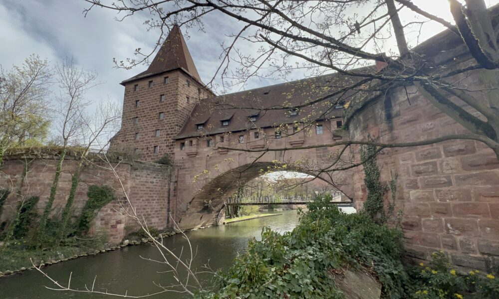 Part of the wall surrounding Nuremberg can be seen here asa bridge over the river