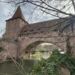 Part of the wall surrounding Nuremberg can be seen here asa bridge over the river