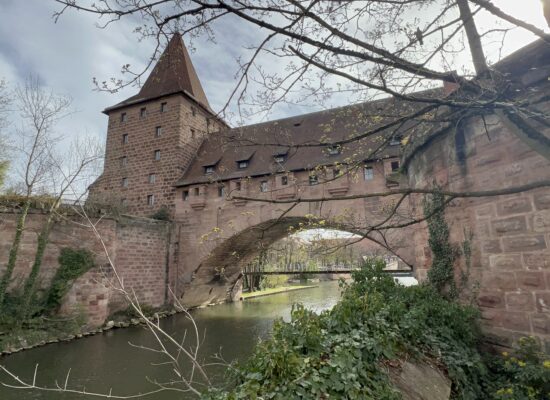 Part of the wall surrounding Nuremberg can be seen here asa bridge over the river