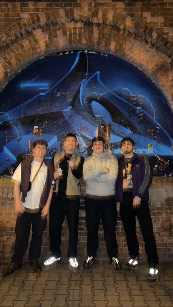 A picture of four British lads outside a factory club in Berlin