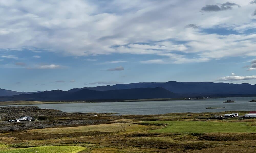 A landscape photo of scenary in Iceland. Mountains can be seen in the distance