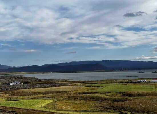 A landscape photo of scenary in Iceland. Mountains can be seen in the distance