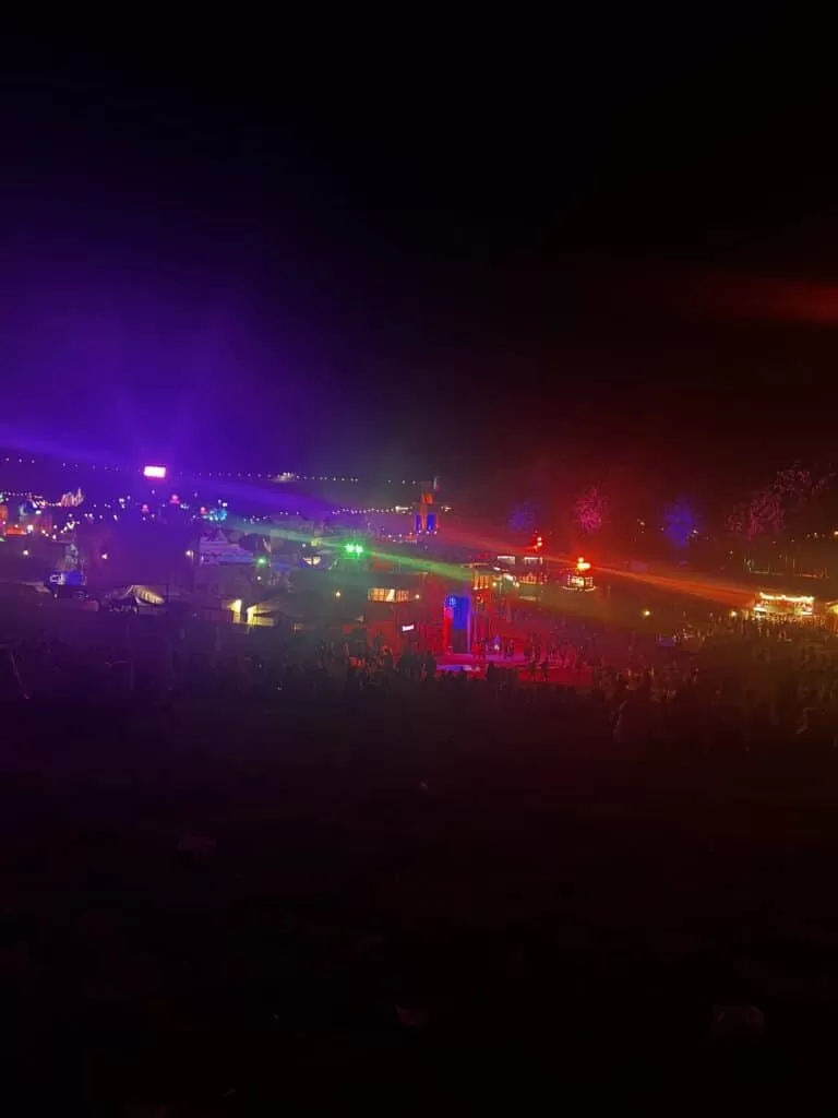 A broad picture of various different colours an buildings from the main arena at Boomtown after the last act had taken place.