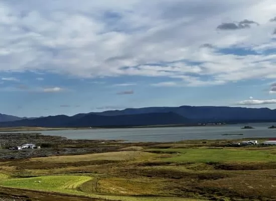 A landscape photo of scenary in Iceland. Mountains can be seen in the distance